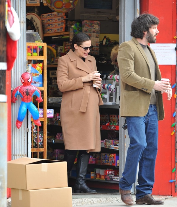 Jennifer Garner, elegantly draped in an Isabella Oliver Maternity coat, and Ben Affleck, casually attired in an Inhabit sweater, were the picture of comfort and style during their Sunday outing in Brentwood, California