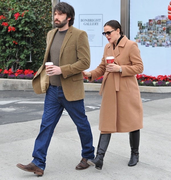 A pregnant Jennifer Garner and husband Ben Affleck exiting a toy store while looking for Christmas presents
