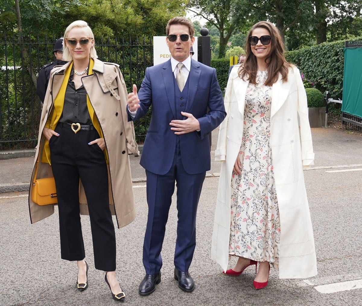 Pom Klementieff (L), Tom Cruise (C), and his then-girlfriend Hayley Atwell attend day 12 of the Wimbledon Tennis Championships
