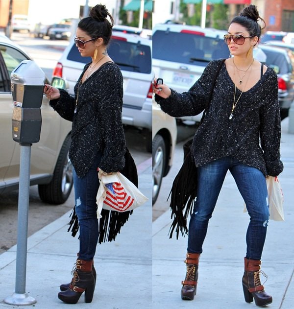 Vanessa Hudgens steps out in Beverly Hills on December 21, 2011, wearing a Silence & Noise slouchy sweater, Siwy Denim Hannah jeans, Free People Miista 'Andee' platform buckle boots, and accessorizing with a fringed Ember Skye handbag, Natalie B necklace, and Marc Jacobs sunglasses