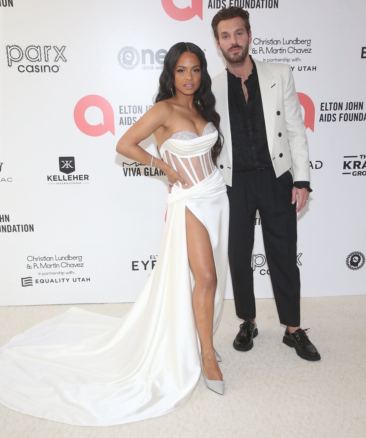 Christina Milian in a white EDITÉ bustier dress and her husband Matt Pokora