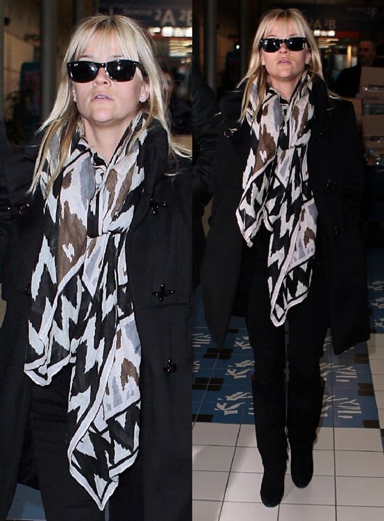 Reese Witherspoon arrived at Charles De Gaulle Airport in Paris, France, on January 26, 2012, donning Ray-Ban Original Wayfarer RB2140 sunglasses in black and a Theodora & Callum black multi Ikat tie-all scarf