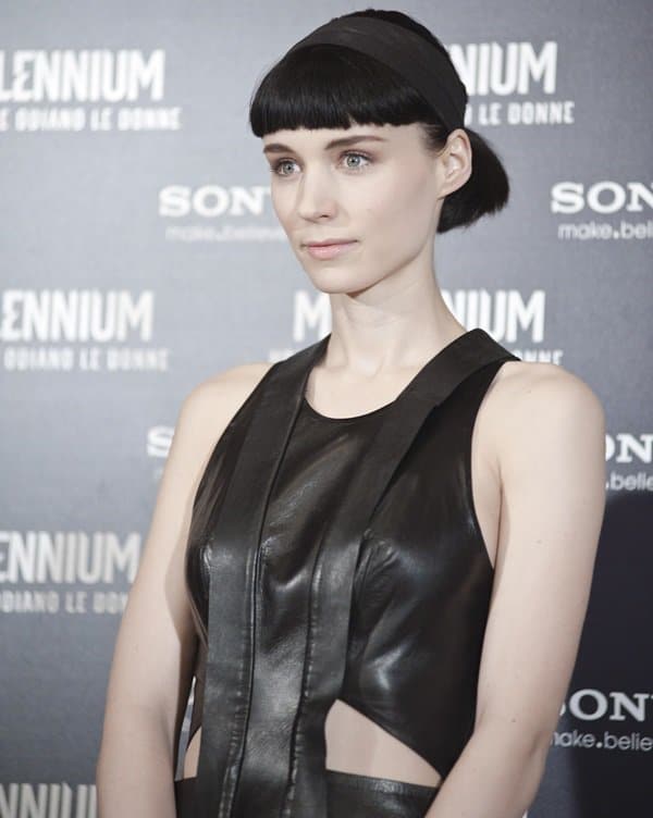Rooney Mara, in a leather dress, attends the photocall of her new movie, 'The Girl with a Dragon Tattoo', in Rome