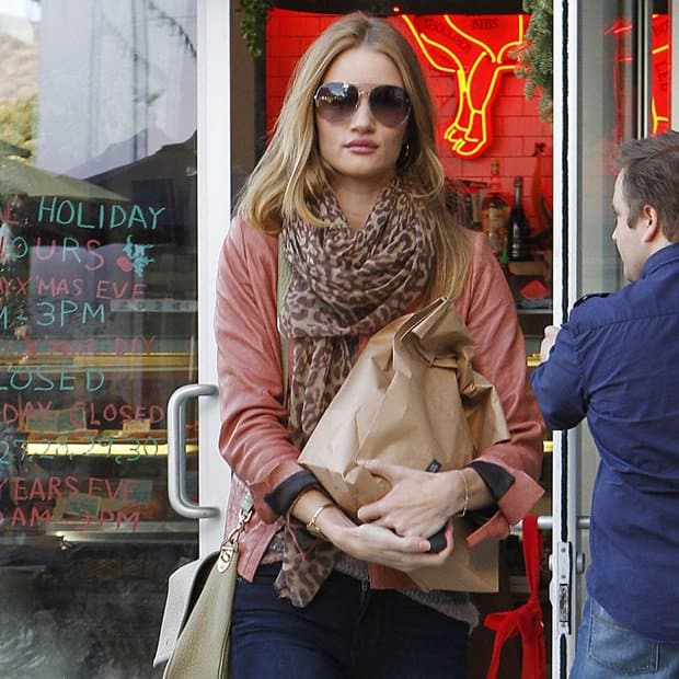 Rosie Huntington-Whiteley wears a Salvatore Ferragamo cashmere leopard scarf