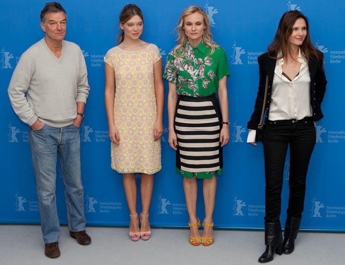 Diane Kruger, flanked by Benoît Jacquot, Lea Seydoux, and Virginie Ledoyen at the Berlin Film Festival, showcasing her unique style with a 10 Crosby Derek Lam dress and Giuseppe Zanotti sandals