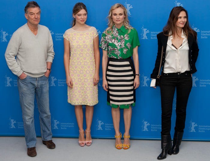 Diane Kruger, flanked by Benoît Jacquot, Lea Seydoux, and Virginie Ledoyen at the Berlin Film Festival, showcasing her unique style with a 10 Crosby Derek Lam dress and Giuseppe Zanotti sandals