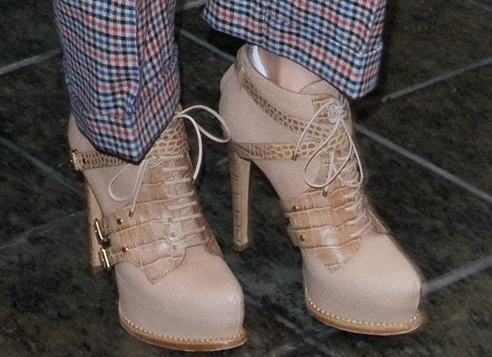 Jennifer Lopez wears crocodile-embellished Guetre booties with her plaid pants