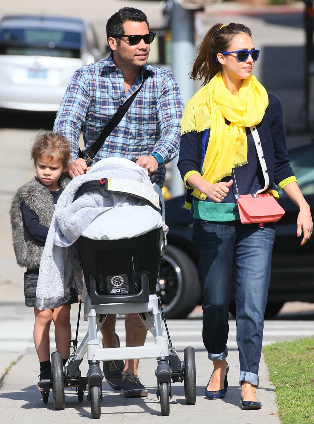 Jessica Alba sported a chic, laid-back look with a color-blocked ensemble, pairing a Kate Spade cardigan and a Jet by John Eshaya sweater with navy Tory Burch flats, accented by a bright Love Quotes scarf and a Proenza Schouler clutch at Coldwater Canyon Park