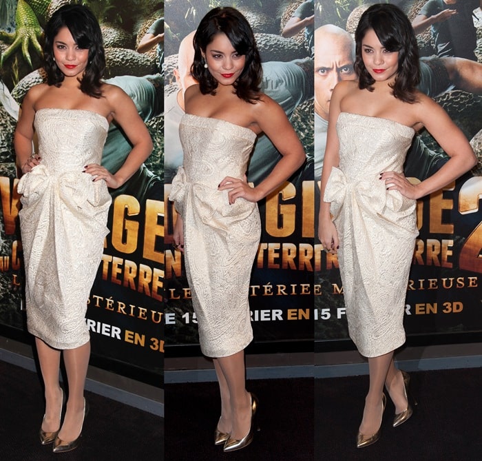 Vanessa Hudgens showcases old Hollywood glamour in a strapless champagne midi dress with a bow detail, paired with skin-tone stockings and metallic gold pointy pumps