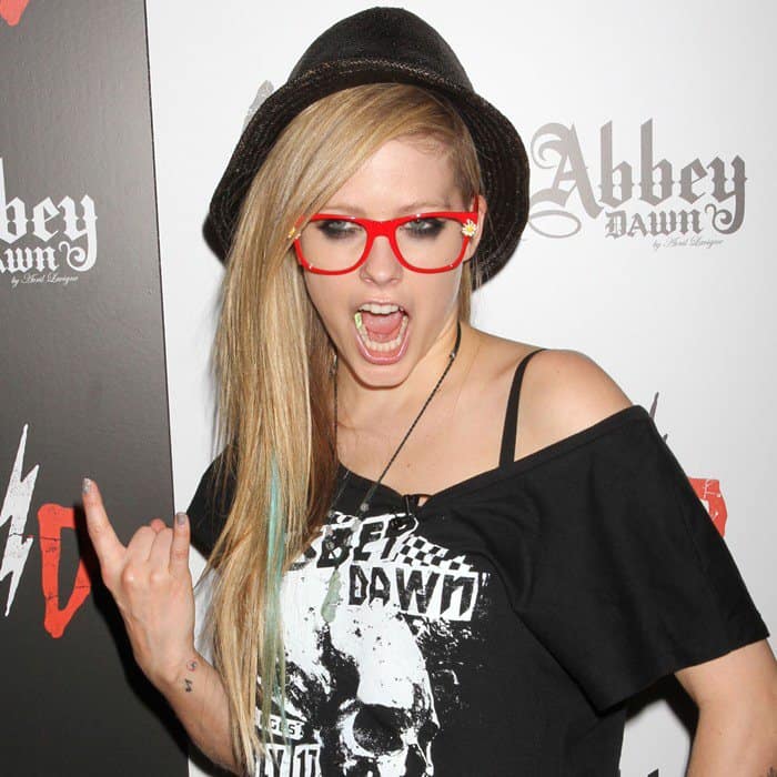 Singer/designer Avril Lavigne visits her Abbey Dawn booth at the 2012 MAGIC Convention at Las Vegas Convention Center on August 21, 2012, in Las Vegas