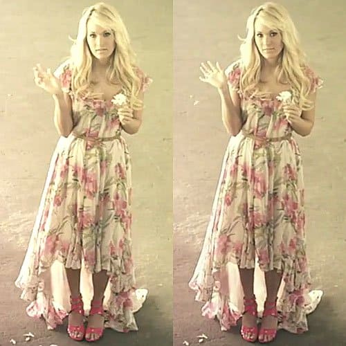 Carrie Underwood channels country-girl charm in a floral high-low Marissa dress by Elizabeth and James, perfectly paired with bold pink heels that add a flirty, unexpected twist