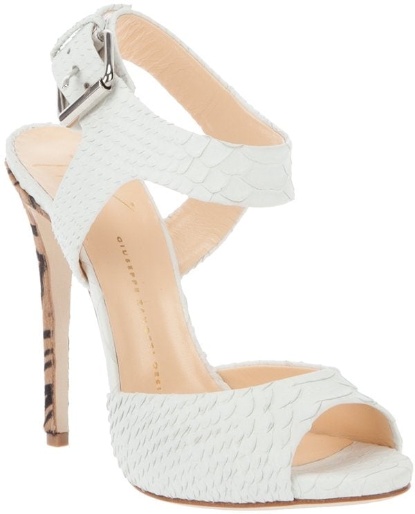 Don't you love the crisp white snake-like leather mixed with the leopard pony heel of this shoe?