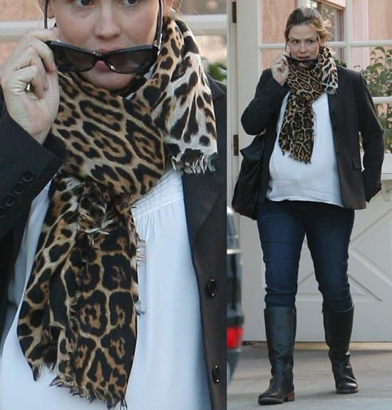 Taken on February 1, 2012, this image features Jennifer Garner in Brentwood, adding a pop of personality to her outfit with a bold, animal print scarf