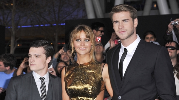 Josh Hutcherson, Jennifer Lawrence, and Liam Hemsworth at the World Premiere of 'The Hunger Games' held at Nokia Theatre in Los Angeles