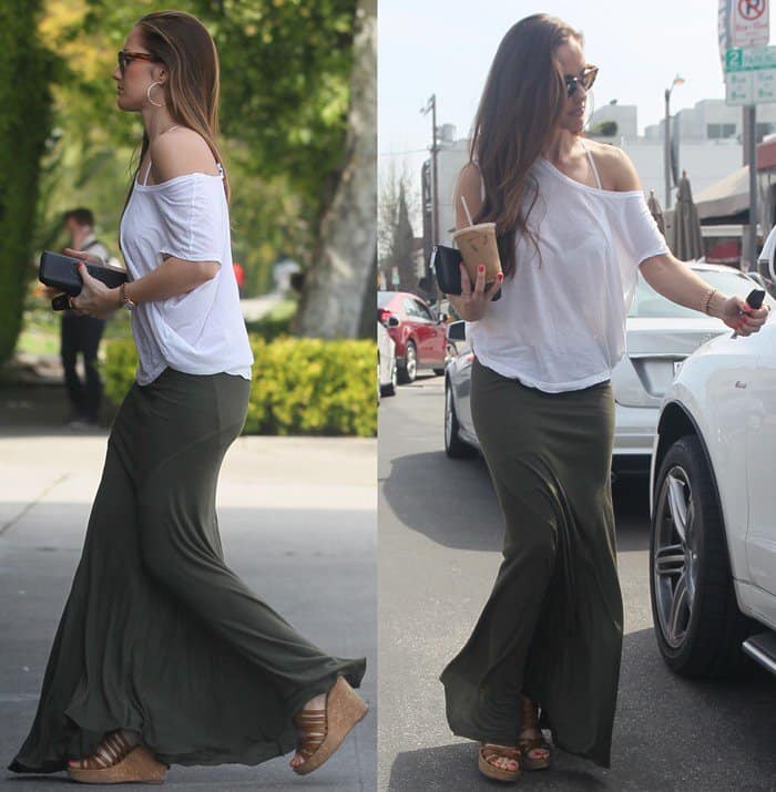 Minka Kelly radiates casual elegance in a white top and army green maxi skirt, highlighting her glowing complexion