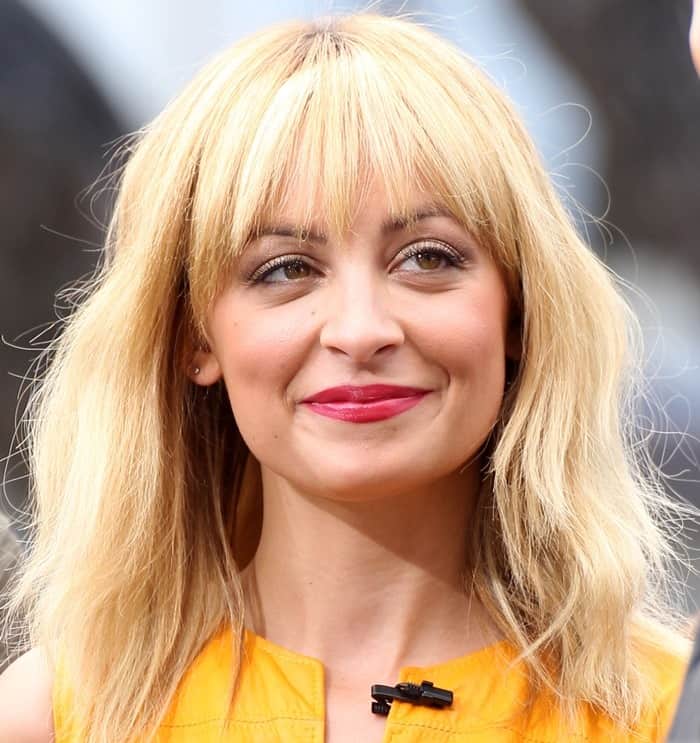 Nicole Richie's deep berry lip shade and messy hair completed her chic look