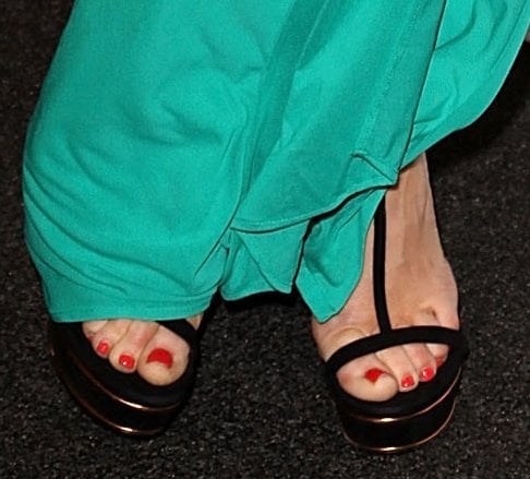 Rose McGowan shows off her feet in python heels by Gucci