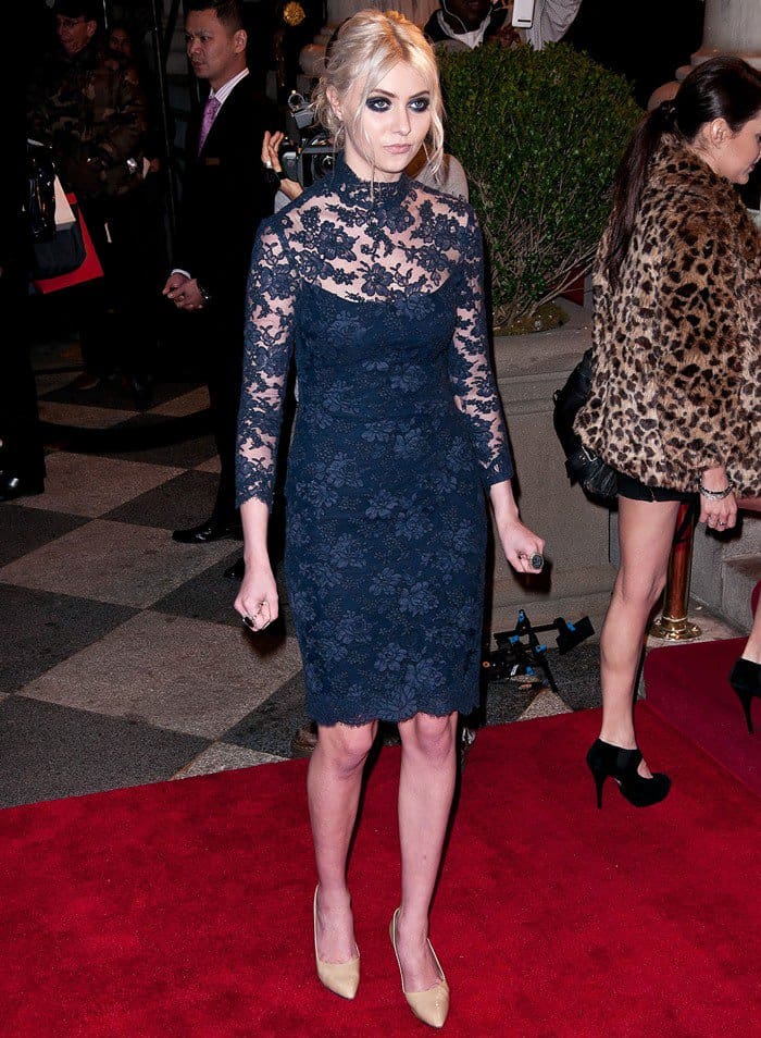 Taylor Momsen, frontwoman of The Pretty Reckless, stunned in a navy lace Marchesa dress paired with classic nude pointy-toe pumps at the Marchesa Fall 2012 show during New York Fashion Week at The Plaza Hotel