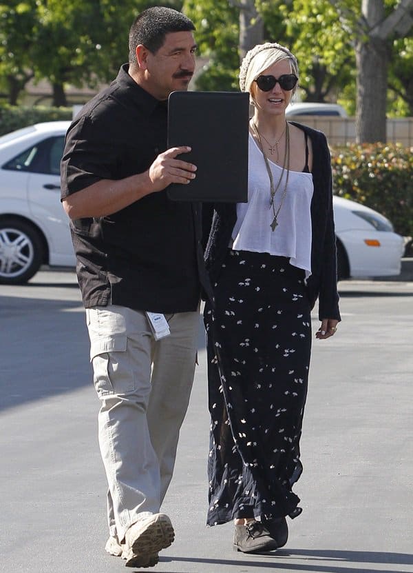 Captured in Los Angeles, Ashlee Simpson radiates chic fashion with her layered cross-pendant necklace, dated April 4, 2012