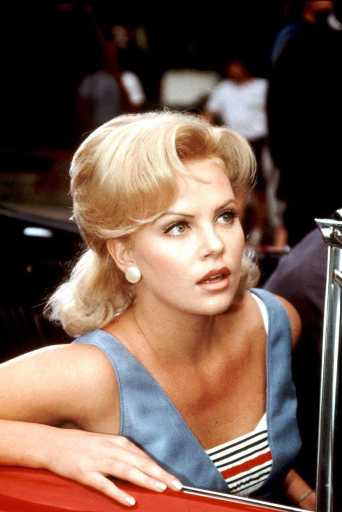 Charlize Theron portrayed Tina Powers, Jimmy Mattingly's stylish and supportive girlfriend, in the 1996 American comedy-drama film That Thing You Do!