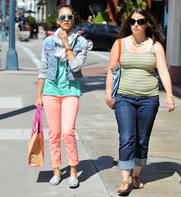 Jessica Alba makes a chic arrival at Le Pain Quotidien in Beverly Hills for a lunch date, showcasing her flair for color coordination with salmon pink J Brand jeans and a striking Rebecca Minkoff tote