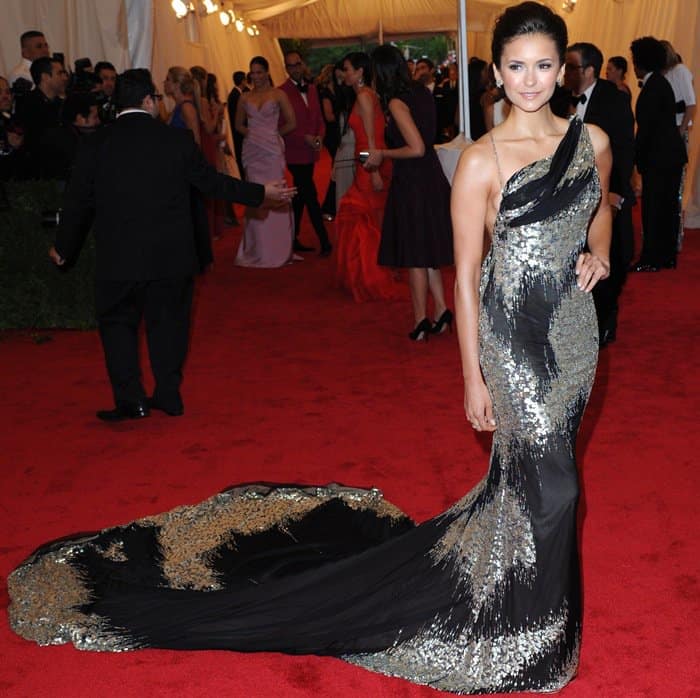 Nina Dobrev in Donna Karan attends the "Schiaparelli And Prada: Impossible Conversations" Costume Institute Gala