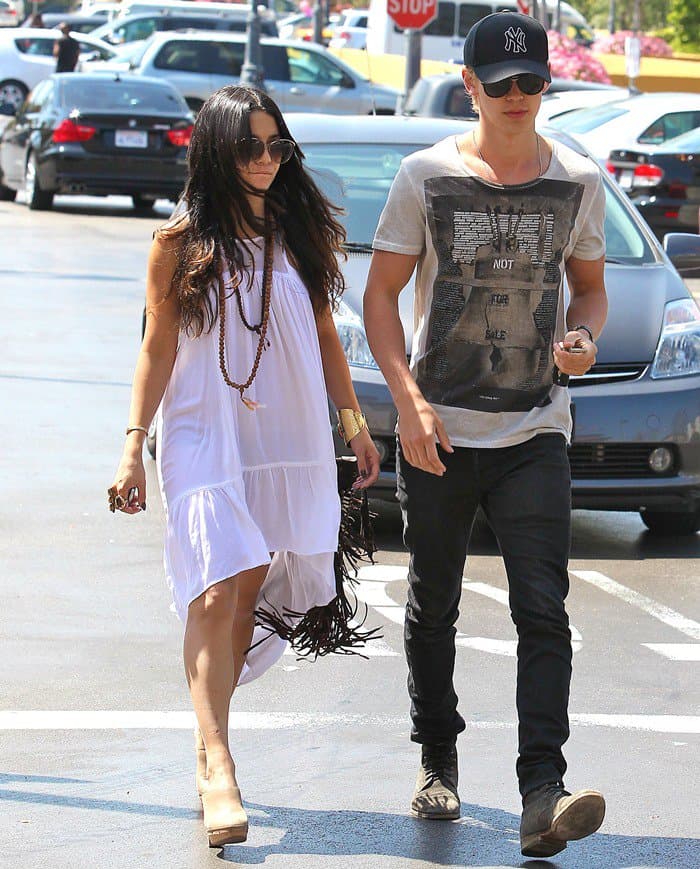 Vanessa Hudgens was spotted shopping at Ralphs Grocery with Austin Butler in Studio City on May 7, 2012, wearing a Local Celebrity Windsong dress, Spell Tassel bag, Samanca Jewelry Kels gold cuff, Natalie B Three Stone saddle ring, Kors Michael Kors Claudia suede platform clogs, and an LJ Designs gold five strand set