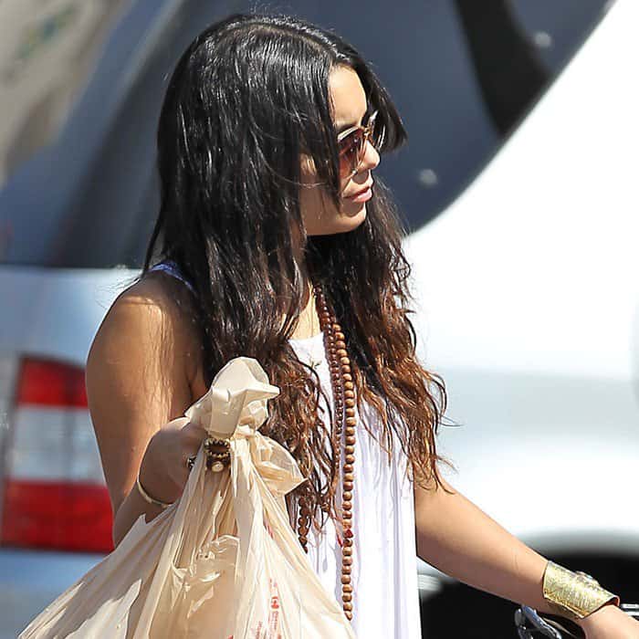 Boho Chic: Vanessa Hudgens, in a breezy white Local Celebrity Windsong dress, complementing her look with a Kels gold cuff by Samanca Jewelry and an LJ Designs gold five-strand set