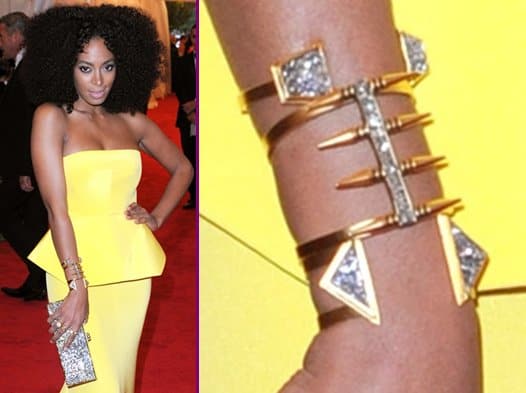 Solange Knowles wears Lady Grey jewelry with a bright yellow strapless Rachel Roy gown at the "Schiaparelli And Prada: Impossible Conversations" Costume Institute Gala