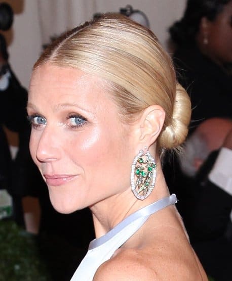 Gwyneth Paltrow wears Anna Hu Haute Joaillerie hooped earrings at the "Schiaparelli And Prada: Impossible Conversations" Costume Institute Gala at the Metropolitan Museum of Art