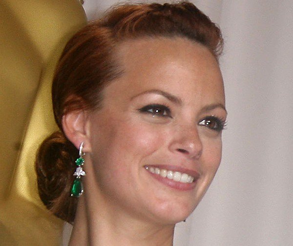 Bérénice Bejo wears stunning earrings featuring two pear-shape 20ct emerald drops suspended from two 3ct emeralds and two pear-shape 4ct white diamonds, set in both platinum and white gold