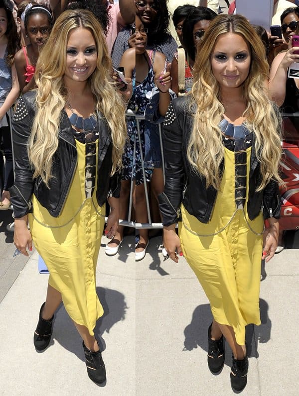 Demi Lovato dazzled at the Sprint Center in Kansas City on June 8, 2012, wearing Topshop's strappy button midi dress, Lady Mama crystal booties by CJG, and a square section body chain