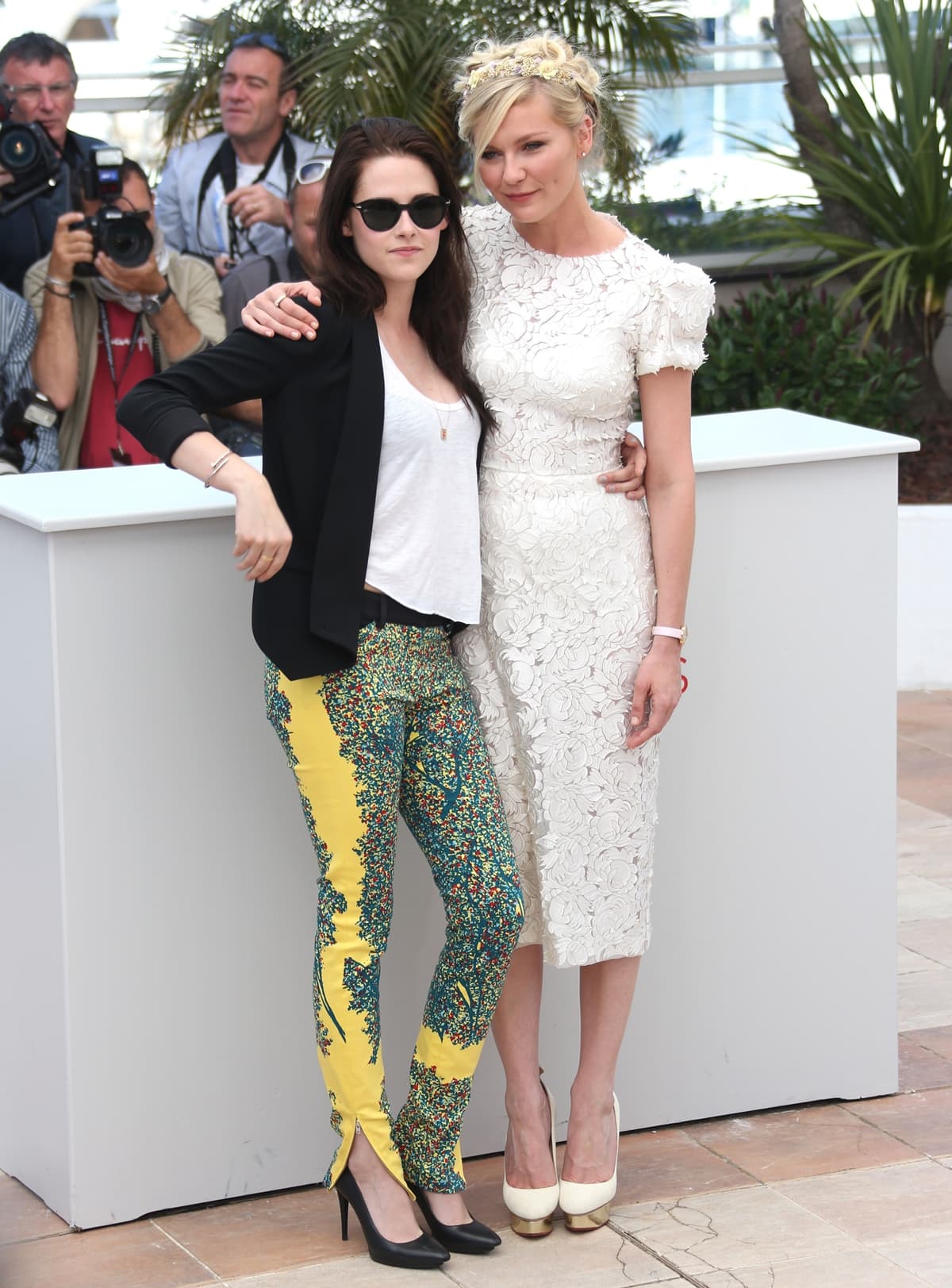 Kristen Stewart and Kirsten Dunst attend the On The Road Photocall during the 65th Annual Cannes Film Festival at Palais des Festivals on May 23, 2012 in Cannes, France