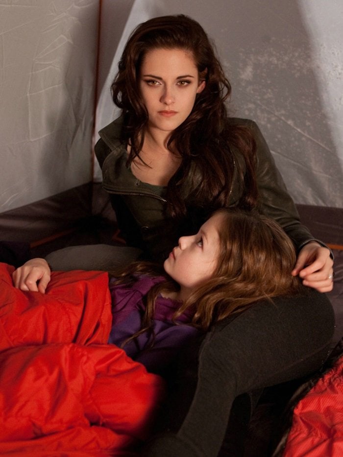 Kristen Stewart as Bella Swan, posing with Renesmee, in a Belstaff double-breasted zip leather blazer jacket