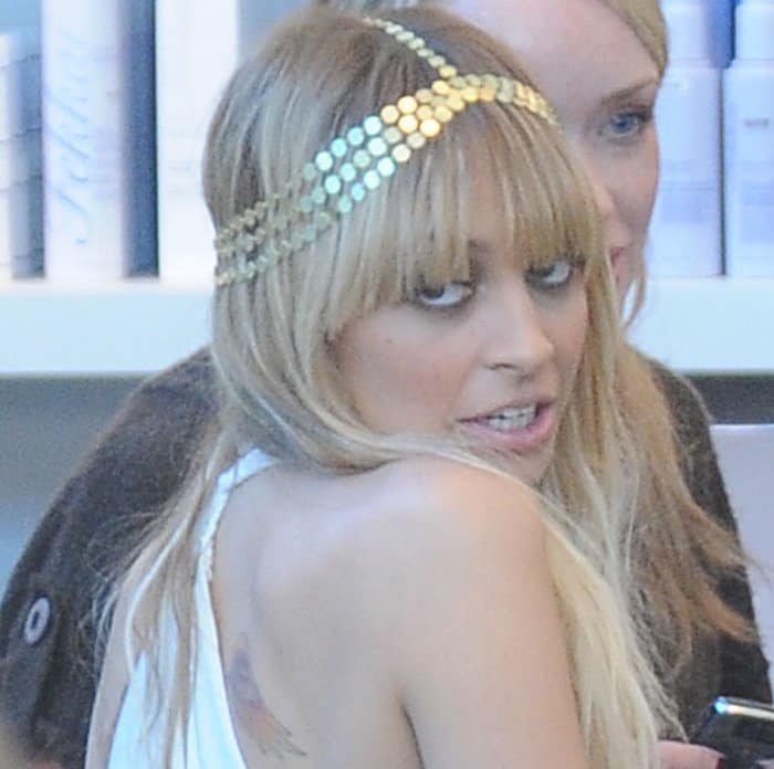 Nicole Richie wearing one of her self-designed headpieces from her jewelry line House of Harlow 1960 at the Kitson Melrose store