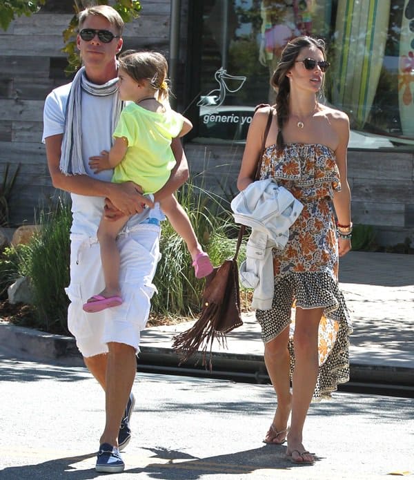 Shopping in Malibu with her daughter Anja and some friends, Alessandra Ambrosio exuded effortless style in Malibu on July 8, 2012, donning a chic Tolani Morgan ruffle dress complemented by the trendy CC Skye Leight Luxe fringe bag