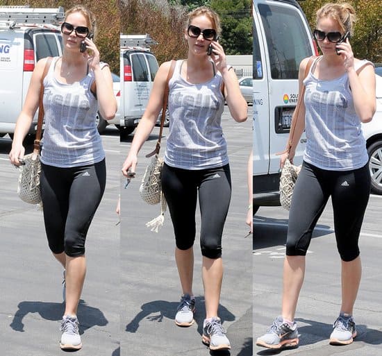 Jennifer Lawrence wearing workout clothes as she talks on her cell phone in Los Angeles