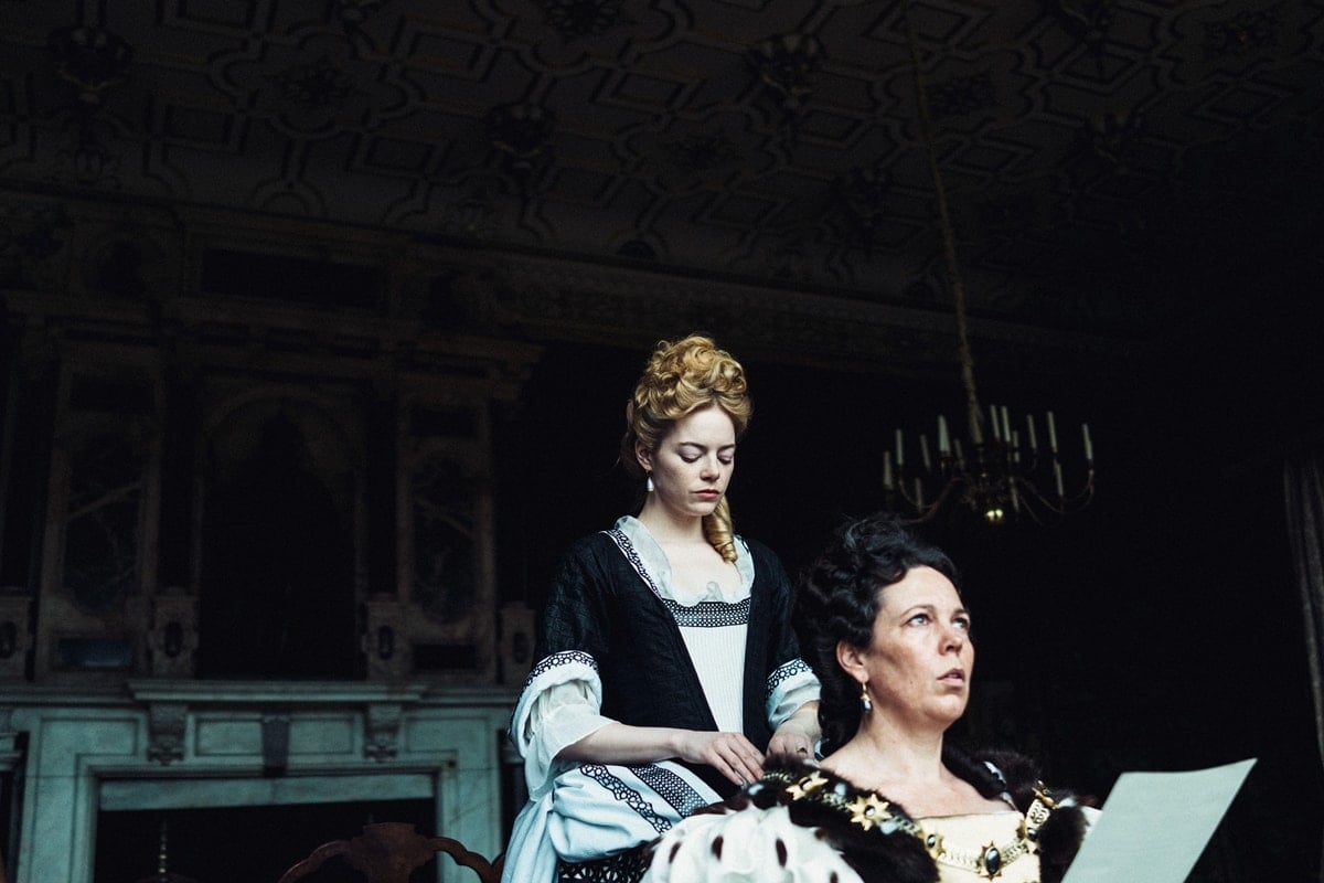 Olivia Colman as Queen Anne and Emma Stone as Abigail Hill in The Favourite