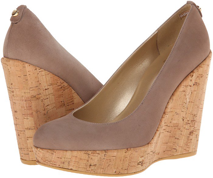 A timeless patent pump is set on a cork-wrapped wedge for updated height and classic comfort