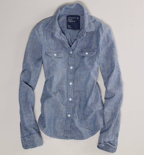 Spotlight on Comfort and Style: This American Eagle Outfitters Chambray Western Shirt, available for $39.95, blends timeless design with casual elegance, perfect for updating your wardrobe