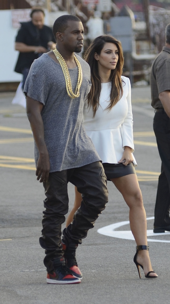 Kim Kardashian and Kanye West on their way to the Heliport in Manhattan after leaving a Soho movie theatre in Union Square New York City on September 1, 2012