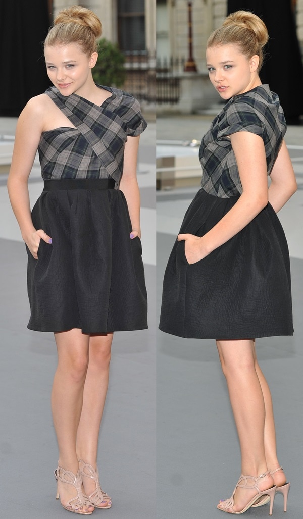 Chloë Grace Moretz shows off the pockets on her plaid Carven dress while flaunting her legs in strappy nude stiletto sandals