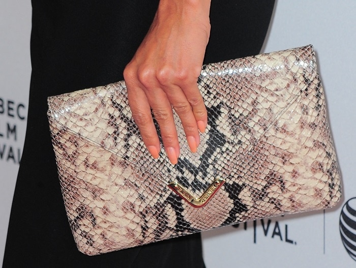 Eva toted Elaine Turner's 'Bella' python clutch