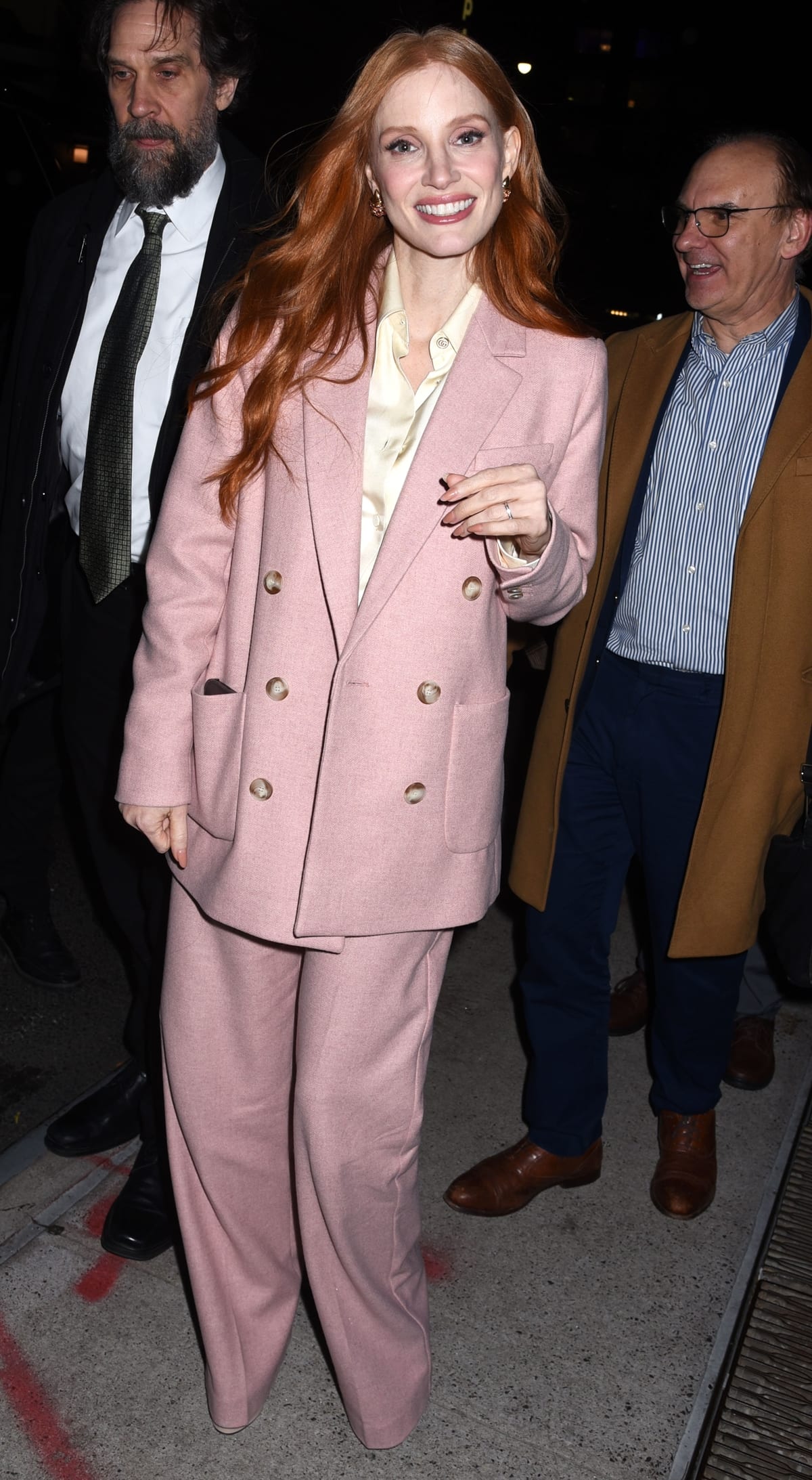 Jessica Chastain stood out in a stylish bright pink double-breasted jacket and slightly oversized pants in New York City