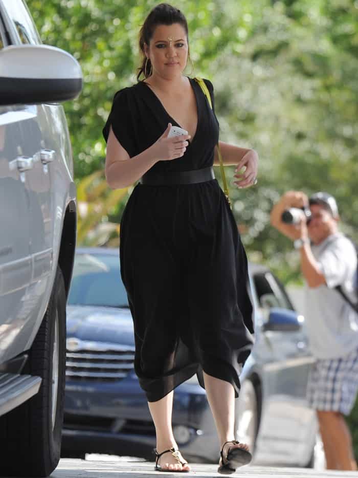 Captured in Miami on September 19, 2012, Khloé Kardashian radiates chic sophistication in her 'Heidi' LBD by Myne