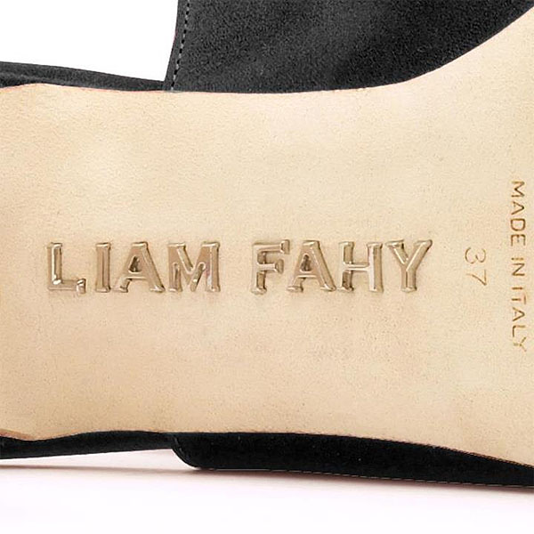 The signature nickel brand label that the soles of each pair of Liam Fahy shoes are embellished with