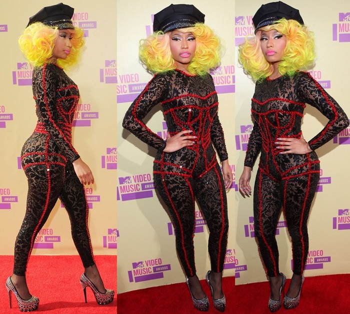 Nicki Minaj wearing a black lace Versace catsuit featuring ruby red jewel embellishments