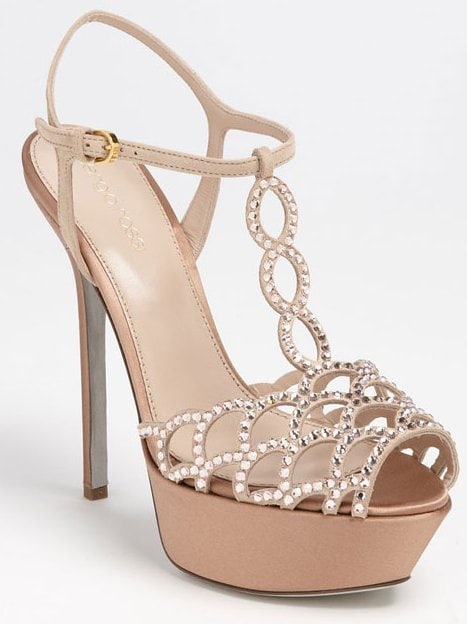 Plush suede dotted with Swarovski crystals shapes a breezy sandal with a high heel and platform, both wrapped in lustrous satin