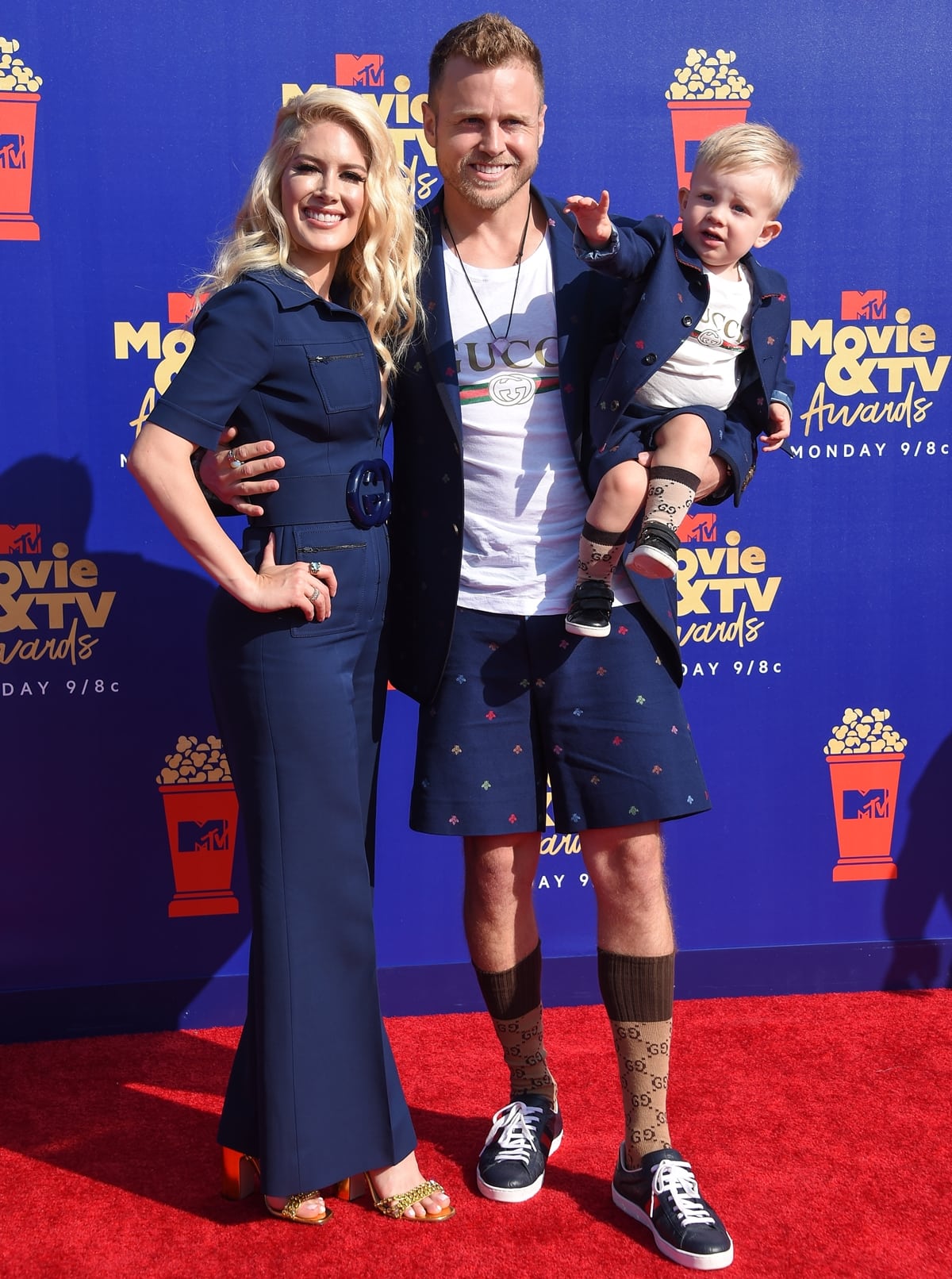 Spencer Pratt with his wife Heidi Montag in a Gucci belted jumpsuit and their son Gunner Pratt