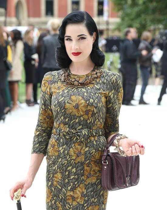 Dita von Teese graces the front row at the Burberry Prorsum show, Day 4 of London Fashion Week Spring/Summer 2013, exuding elegance and style in her ensemble on September 17, 2012, in London, England